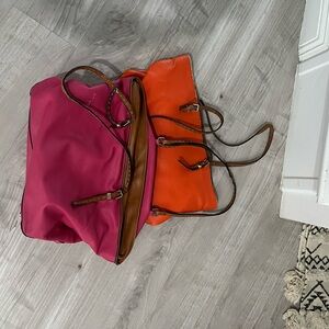2 leather purses in pink and orange